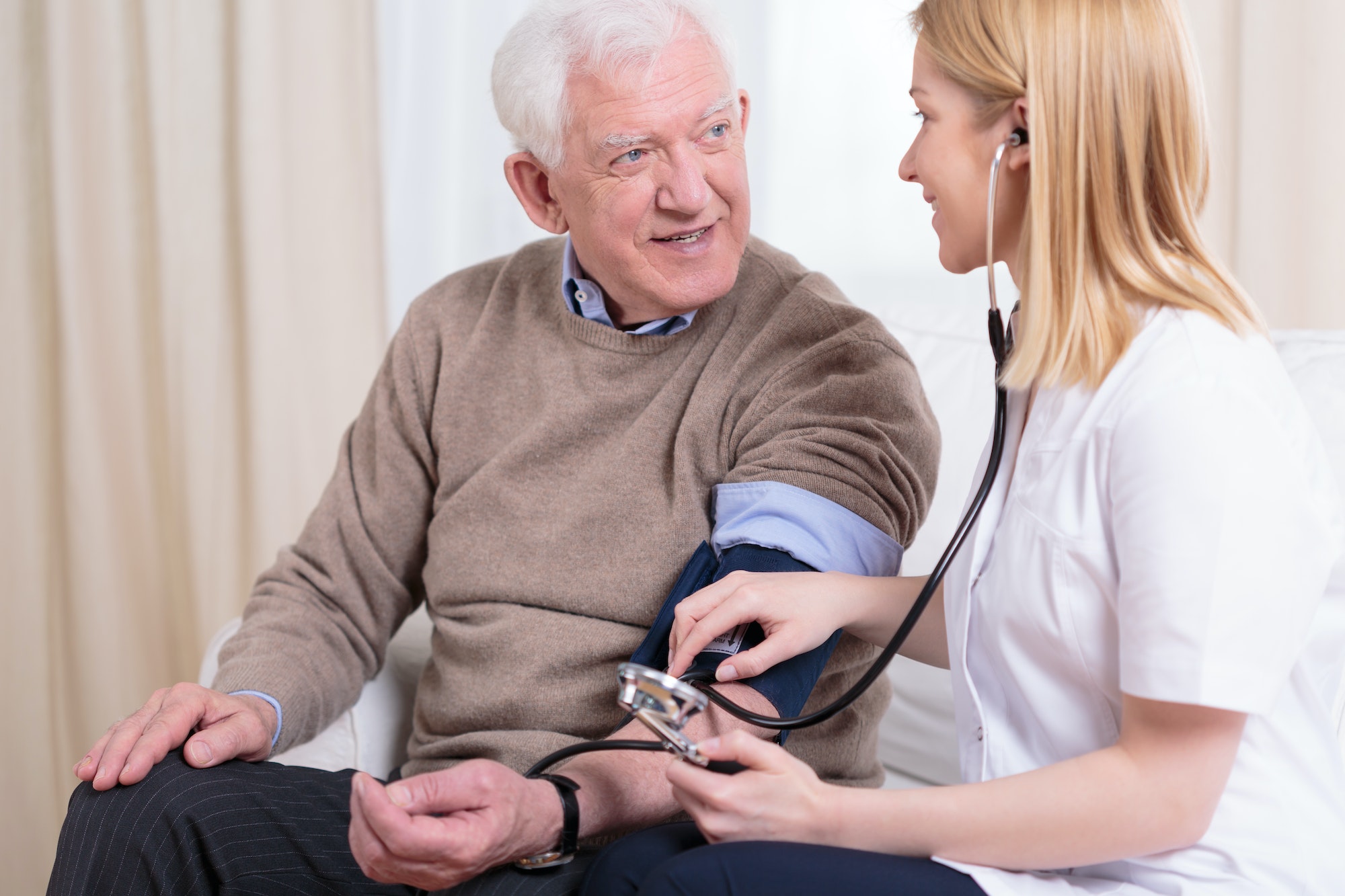Caregiver checking the hypertension